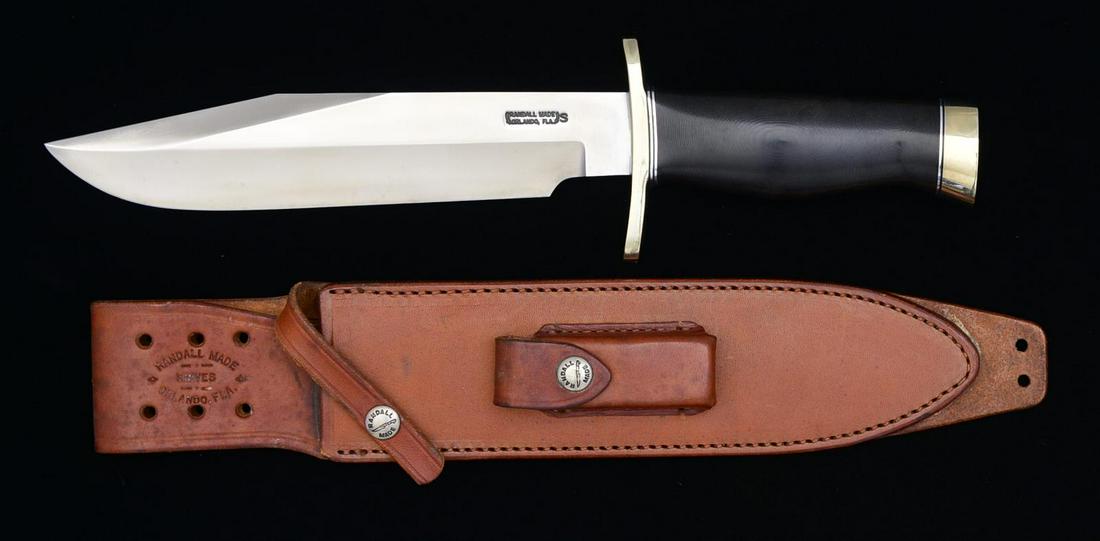 RANDALL NO. 14 SPORTSMAN BOWIE W/ NICKEL FORWARD: CURVE DOUBLE HILT & SHEATH. 9" Blade (8 3/4), 14" overall. Blade marked “RANDALL MADE / ORLANDO FLA.”. Black micarta handle w/ nickel butt. UNATTACHED ACCESSORIES: brown leather sheath w/ sharpeni