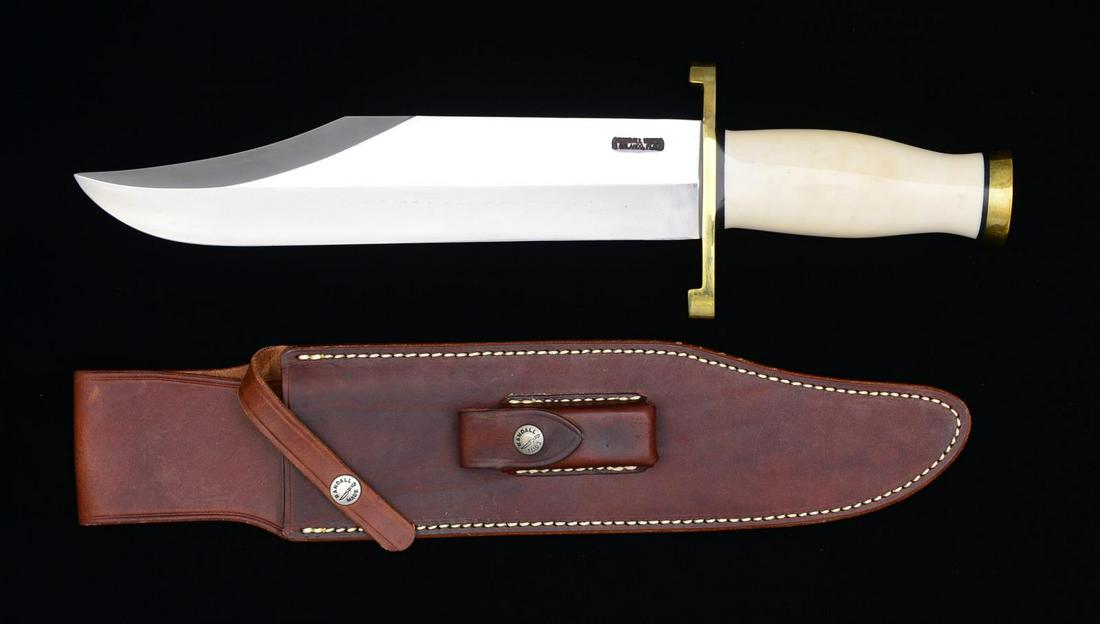 RANDALL MODEL 12 SMITHSONIAN BOWIE W/ SHEATH.: 11" Blade (10 3/4"). Blade marked "RANDALL MADE ORLANDO FLA" ."16" OA. Brass lugged hilt; Ivorite handle, brass butt cap. Brown leather sheath w/ sharpening stone. Sheath has "RANDALL MADE SNAP". Shea