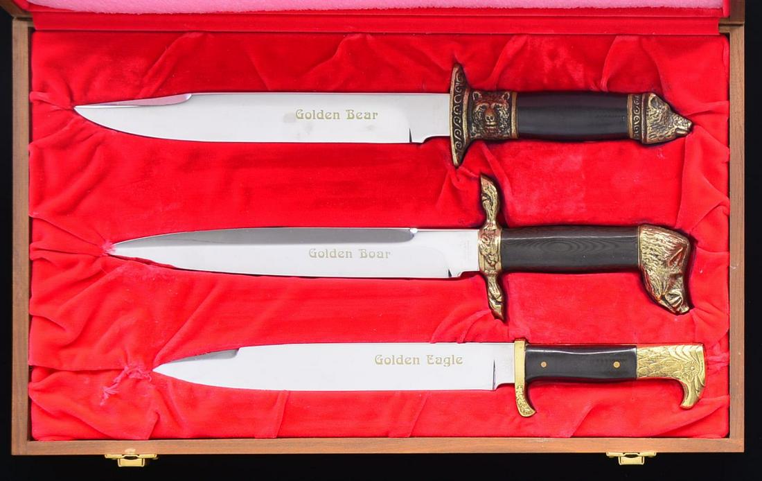 KERSHAW GOLDEN BEAR, BOAR, & EAGLE 3 KNIFE SET.: 1) GOLDEN BEAR. BLADE: 9 1/4”. Overall: 15 1/2”. Blade is marked “GOLDEN BEAR” & “KERSHAW / SOLINGEN – GERMAN ROSTFREI”. Handle has cast bear head motif on hilt & pommel w/ dark micarta