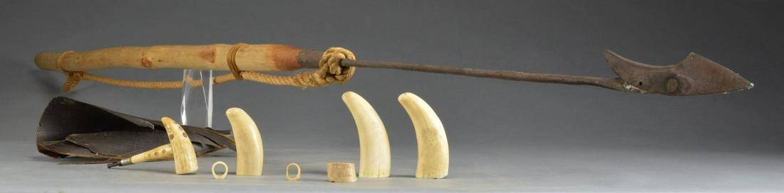 19TH CENTURY WHALING SOUVENIERS.: Harpoon, about 7 1/2' overall, w/ 31" iron point w/ pivoting barb tip that will not come out once embedded. There is a looped rope attached w/ cord. / 2 Whales teeth w/ designs of Victorian figures. /