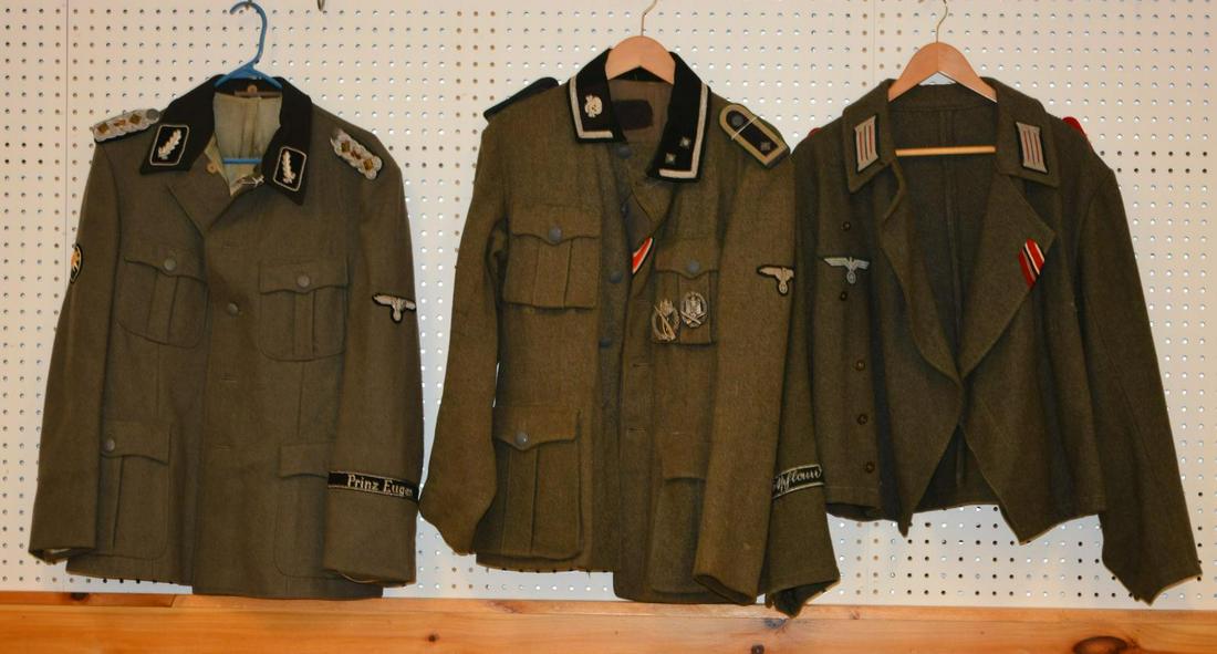 3 REPRODUCTION WWII GERMAN TUNICS.: 1 SS staff sergeant tunic w/ Infantry Assault badge. 1 Artillery battle jacket w/ shoulder straps. 1 SS tunic for a colonel in the Prinz Eugen division w/ a bullion eagle on 1 sleeve & Edelweiss patch