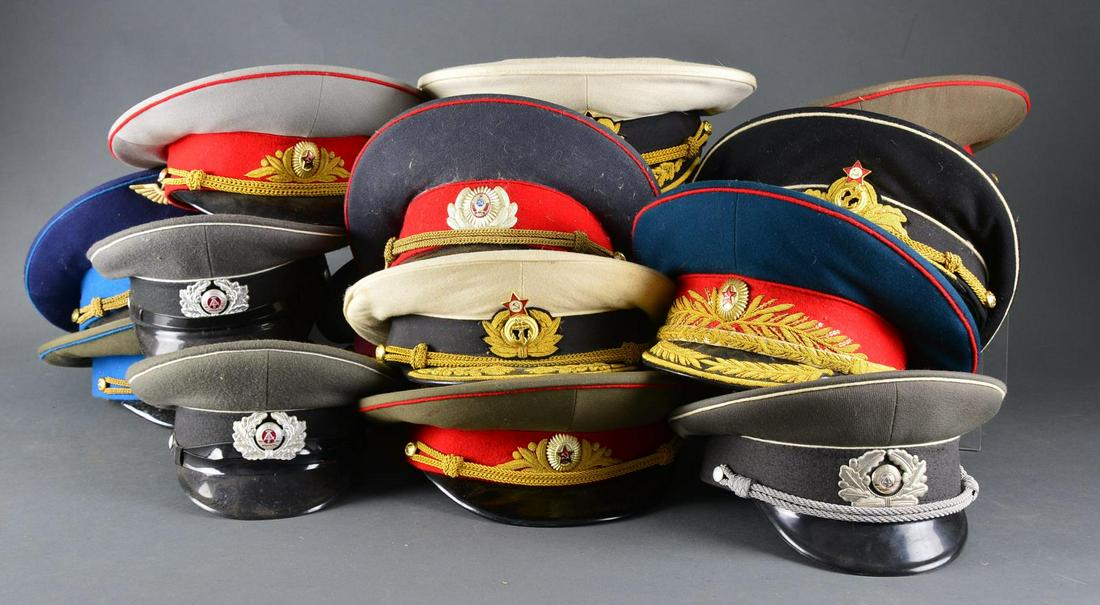 LARGE GROUP OF RUSSIAN, EAST GERMAN &: INDONESIAN HATS. This interesting group contains approx. 40 mostly Russian & East German military hats along w/ 2 Indonesian Police peaked caps. Hats represent various branches of the military & inclu