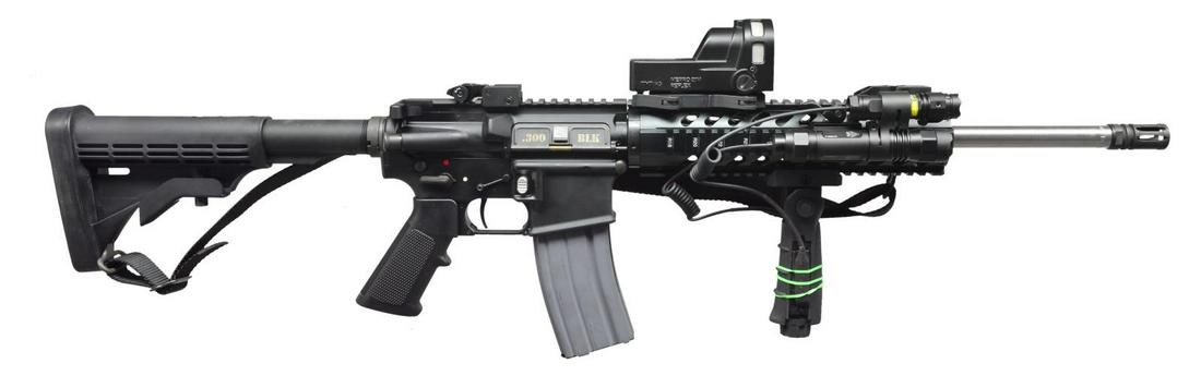 300 AAC BLACKOUT RIFLE BY ANDERSON MANUFACTURING.: Cal. 300 AAC Blackout. S# 16203657. Bbl.16”. Heavily accessorized carbine variant of the popular black rifle. Stainless steel 1:8 bbl. w/ threaded muzzle terminated w/ A2 flash hider. Free float