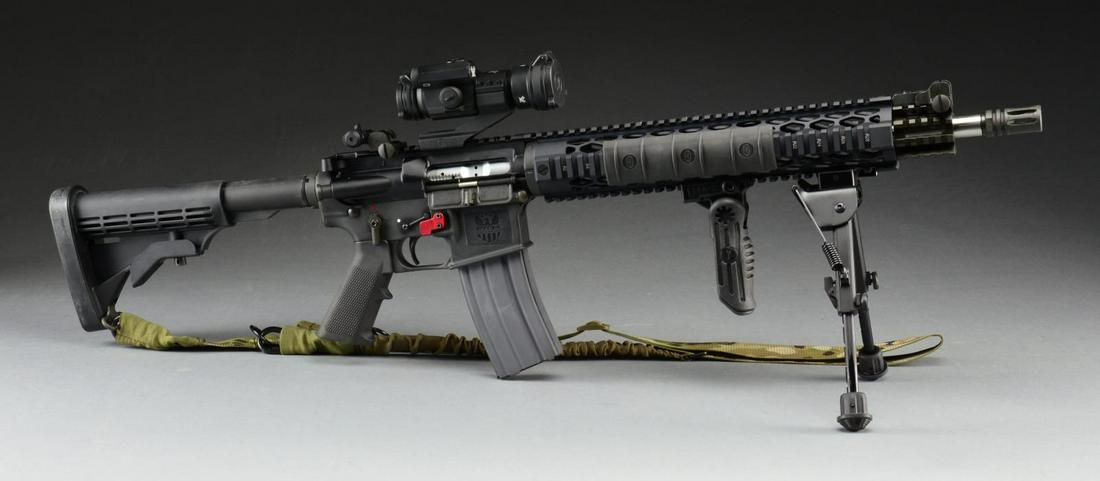 5.56 MM FMK AR-15 STYLE CARBINE & ACCESSORIES.: Cal. 5.56mm. S# FMK33177. Bbl. 16”. Heavily accessorized dissipater style variant of the popular black rifle. Stainless steel heavy bbl. w/ threaded muzzle terminated w/ A2 flash hider. Free flo