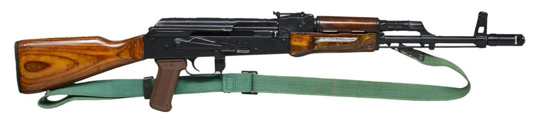 ORIGINAL EGYPTIAN MAADI ARM SEMI-AUTO RIFLE.: Cal. 7.62x39. S# AC0057721. Bbl. 18 3/4". The orange/brown tinted laminated wood is an immediate indication of an Egyptian mfg. MAADI ARM AK-47 variant. A stamped receiver, sans scope mount, & a dark 