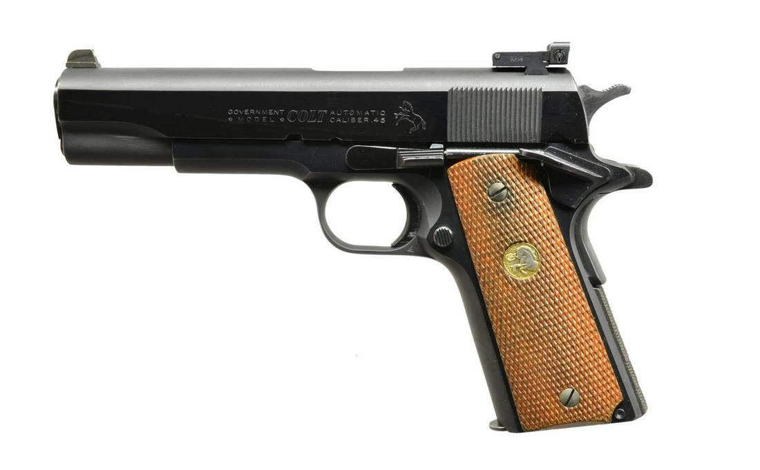 COLT 1911A1 GOVERNMENT MODEL COMMERCIAL SEMI AUTO: PISTOL. Cal. 45 ACP. S# 281429-C. Bbl. 5" replacement Mark IV Series 70. MH3 custom 3 dot night sights. Blued finish. Mainspring housing has added checkering. 2 Piece checkered walnut grips w/ Rampant