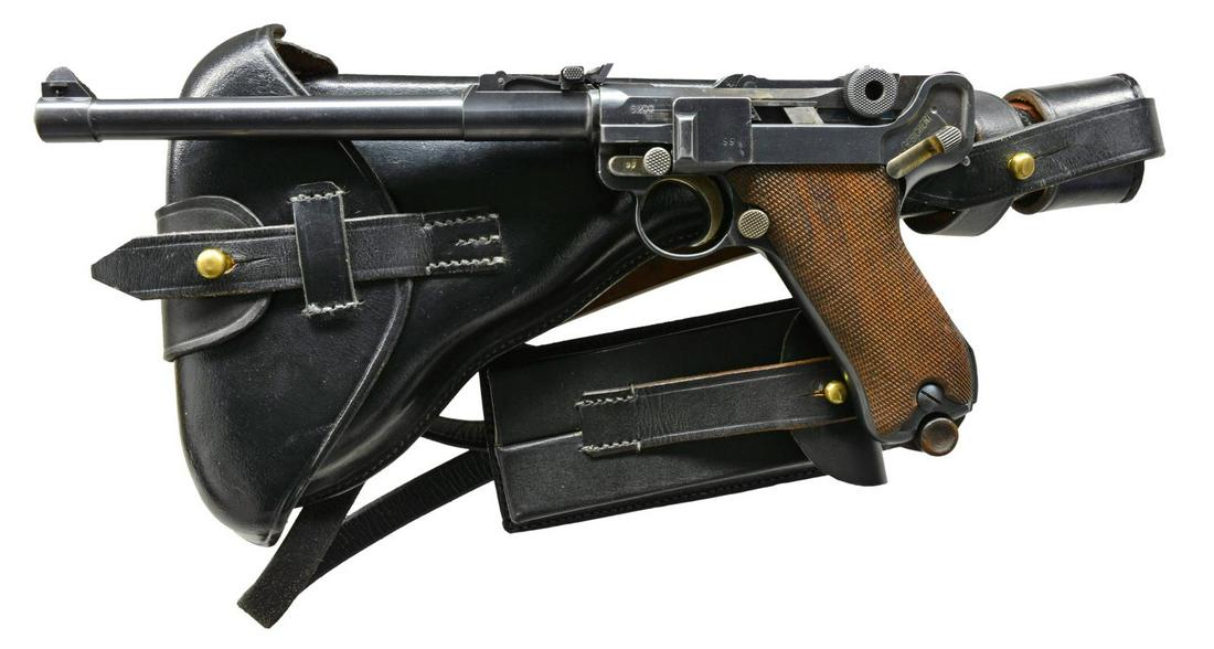 DWM 1914 ARTILLERY LUGER SEMI-AUTO PISTOL RIG.: Cal. 9mm Luger. S# 6299a. Bbl. 8". Mfg. 1916; 20,000 units. Highly desirable model w/ all matching numbers including checkered walnut grips & fine tune sight assembly. Strawed sm. parts & appropriate 