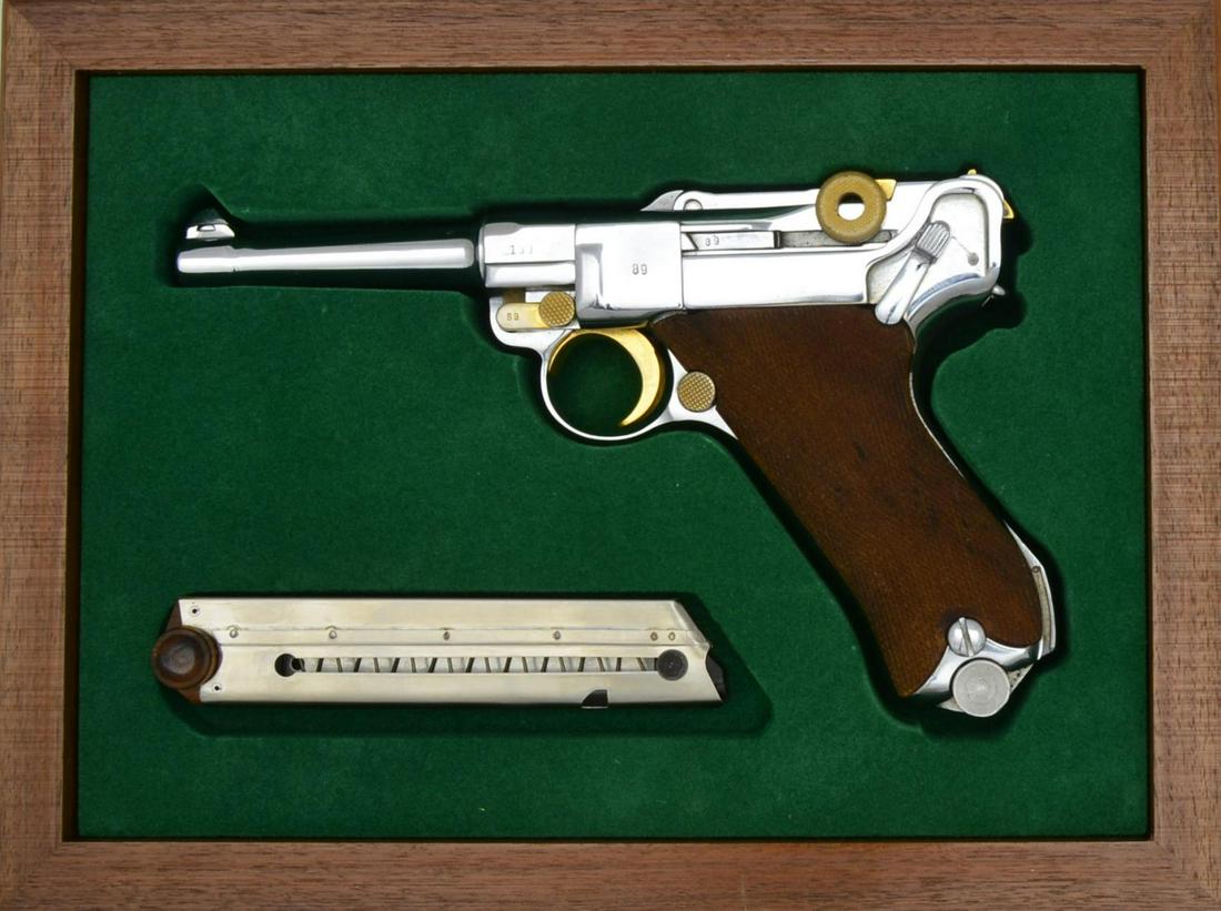 MAUSER 42 CODE LUGER SEMI-AUTO PISTOL.: Cal. 9mm Luger. S# 189v. Bbl. 4" w/ fin shaped front sight. Attractive appearance as chrome plated w/ gold accents comprised of takedown lever, trigger, mag. latch & rear toggle. Mostly matching numbe