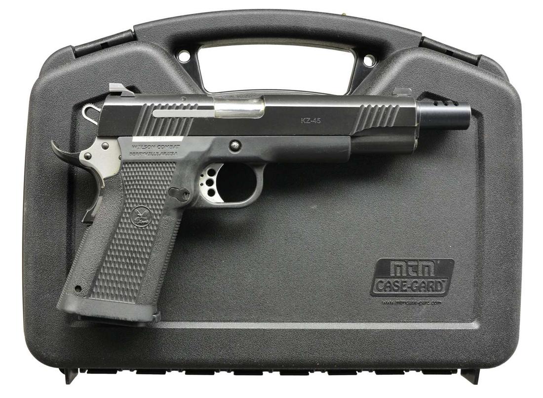 WILSON COMBAT MODEL KZ-45 SA SEMI AUTO PISTOL.: Cal. 45 ACP. S# WCP001569. Bbl. 5" stainless steel. Black finished alloy slide w/ slotted muzzle break. Steel reinforced polymer frame w/ integral grips. 3 Dot sights. Skeletonized trigger. Target sty