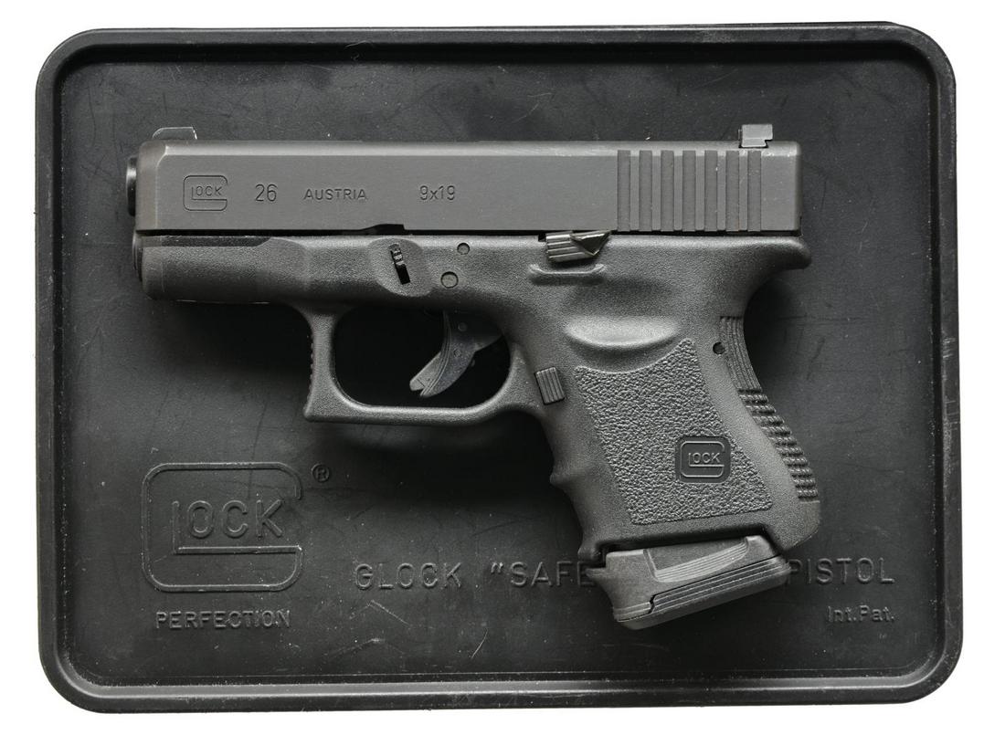 GLOCK 26 SUBCOMPACT 9MM PISTOL.: Cal. 9x19. S# BYC578US. Bbl. 3.4". Sub compact polymer frame striker fired pistol that still allows a bakers dozen in capacity. Matte black finish. Serrated slide w/ 3 dot Trijicon night sights, drift