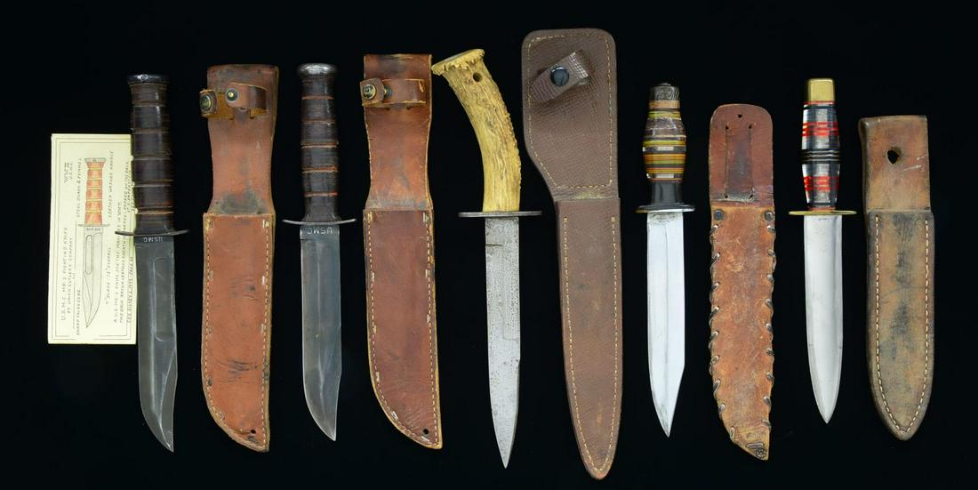 5 WWII FIGHTING KNIVES.: 1) Overall length: 12 1/4". Blade length: 7". This is a classic USMC MK-2 KA-BAR fighting knife. Darkened clipped point single fullered blade marked â€œUSMC” at the ricasso on one side & â�