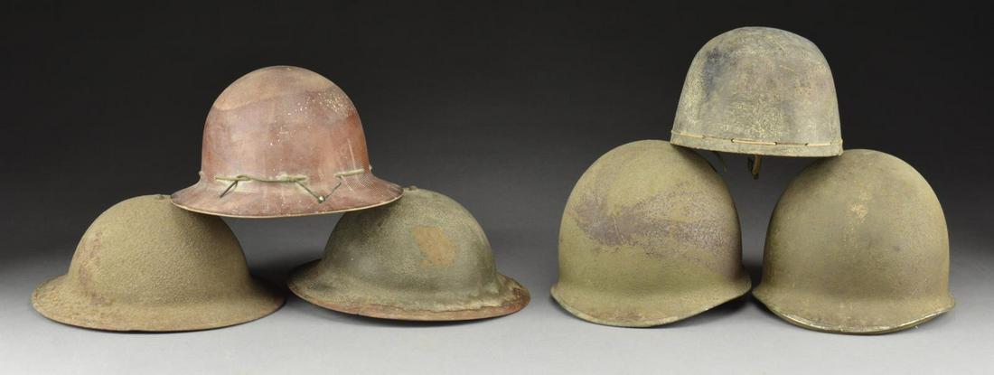 10 WWII HELMETS.: 1) US M1. This helmet has a front seam & fixed bail. It has a standard green sanded finish. The liner is an early pressed fiberboard type Hawley. Chinstrap is complete. CONDITION: approx. 90% of the f