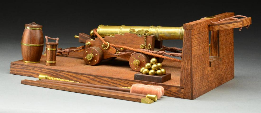 FINELY DETAILED FURR ARMS SCALE MODEL OF BRONZE: CANNON FROM HMS VICTORY WITH MOCK UP OF GUNDECK RIGGING AND CORRECT STYLE ACCESSORIES. Carl Furr of Orem, Utah is known for his meticulously detailed, firing scale models of varying ordnance. This mod