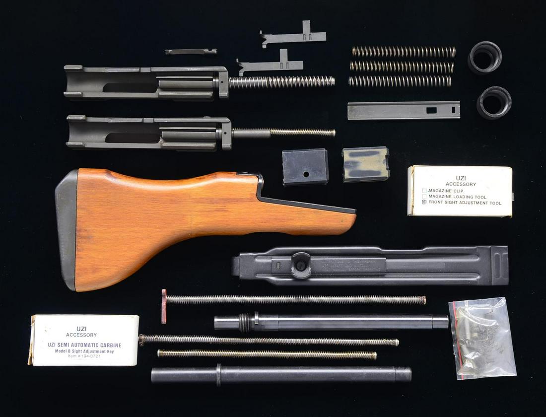 UZI SMG/CARBINE PARTS & ACCESSORIES.: Several parts & accessories for Uzi SMG & Carbine models, including: 2 bbls., 1-9 1/4" w/ threaded muzzle, the other 1-10 1/4" w/ out threaded muzzle. 1 Wooden stock of unknown origin. / Uzi Action Ar