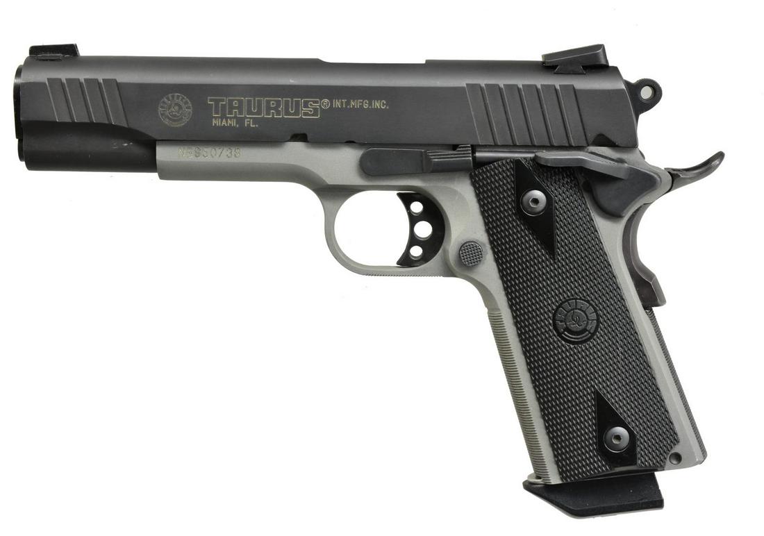 TAURUS PT1911 WITH TWO TONE FINISH.: Cal. 45 ACP. S# NBS50738. Bbl. 5" w/ 3 dot sighting system. Dark finish slide & gray finished frame. MAGS: 1-8 rd. mag. CONDITION: fine w/ evidence of limited use. Some high edge wear on slide & a few