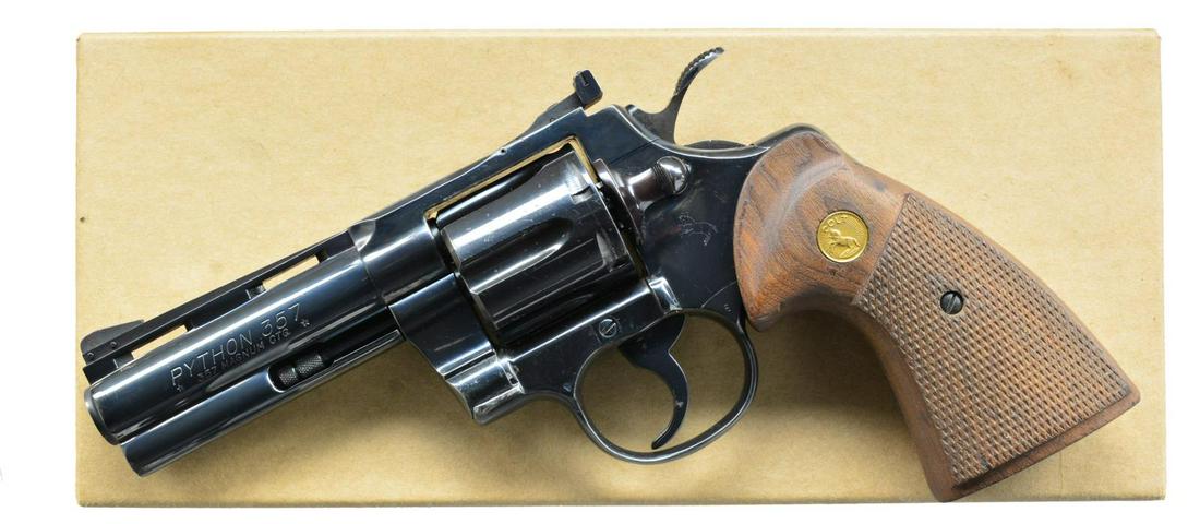 COLT PYTHON DA REVOLVER.: Cal. 357 Mag. S# K79642. Bbl. 4" w/ VR & full lug. Serrated ramp pinned blade front sight w/ adj. square notch rear sight. 6 Shot fluted cyl. Blue finish. 2 Piece checkered walnut target grips w/ gold