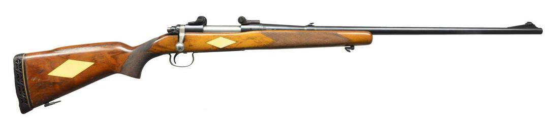 REMINGTON MODEL 721 BOLT ACTION RIFLE.: Cal. 300 H&H Mag. S# 333745. Bbl. 26" w/ ramp mounted bead front sight & folding leaf rear sight. Action has Bausch & Lomb scope mts. 2 Lug action w/ safety right of top tang. & blind box mag. Walnut 