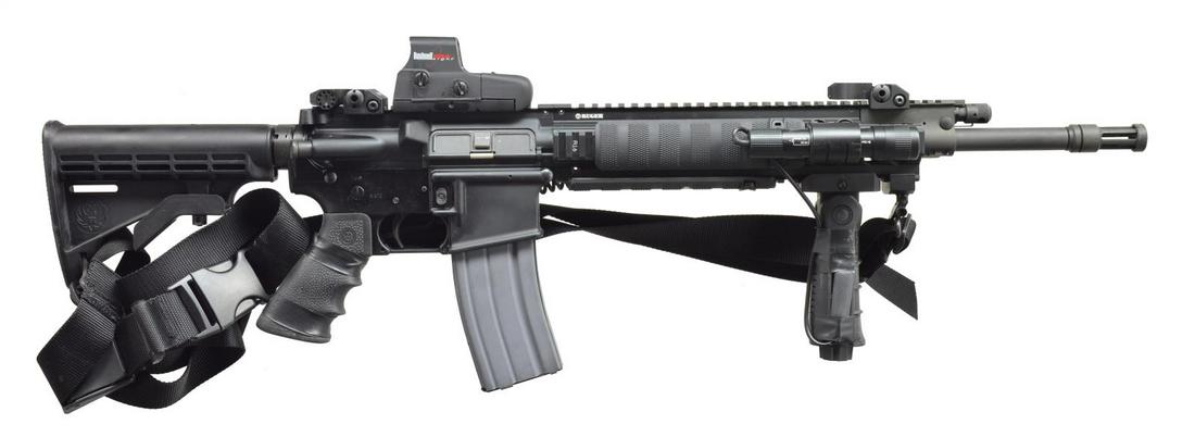 RUGER SR-556 GAS PISTON RIFLE.: Cal. 5.56 MM. S# 590-00454. Bbl. 16". The Ruger variant of the USA's most popular modern sporting rifle. 1:9 Bbl. terminated w/ a threaded muzzle & Ruger flash hider reminiscent of the one they've use