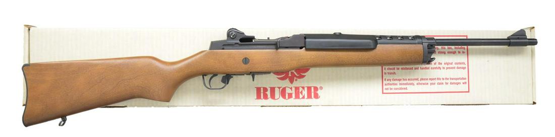 LIKE NEW RUGER MINI 14 BLUED CARBINE WITH: FACTORY BOX. Cal. 223. S# 186-09028. Bbl. 18". The Ruger Mini 14 has earned a reputation as a long standing, reliable rifle w/ several subtle similarities to the war proving M14. Blued bbl. & receiver