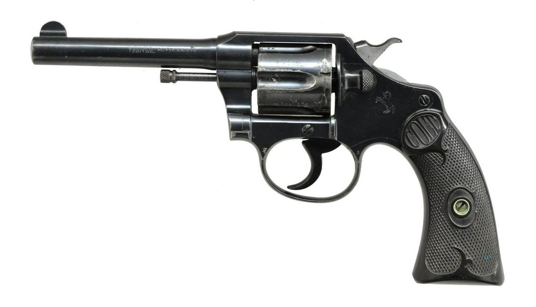 COLT POLICE POSITIVE DA REVOLVER.: Cal. 32 Colt New Police. S# 201616. Bbl. 4" w/ semi circular front sight. 6 Shot fluted swing out cyl. Blue finish. Sideplate has Rampant Colt. 2 Piece checkered hard rubber grips. First Issue revolve