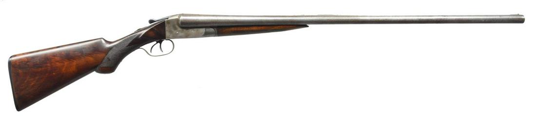 ITHACA GRADE 1 1/2 FLUES MODEL SXS SHOTGUN.: Cal. 12 Ga. S# 235155. Bbls. 30" of Damascus steel w/ fixed Mod. & Full chokes. Brass front bead. Chambers are lengthened to 2 3/4". Case colored boxlock action w/ Grade 1 1/2 engraving featuring poin