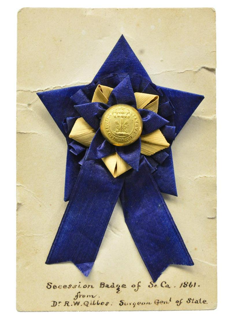 THE FINEST CONFEDERATE SECESSION BADGE KNOWN.: Confederate Surgeon General of South Carolina Secession Badge, 2" x 3.25", mounted on period card, 2.5" x 4" inscribed, "Secession Badge of So Ca. 1861 from Dr. R. W. Gibbes: Surgeon Gen'l of State." 