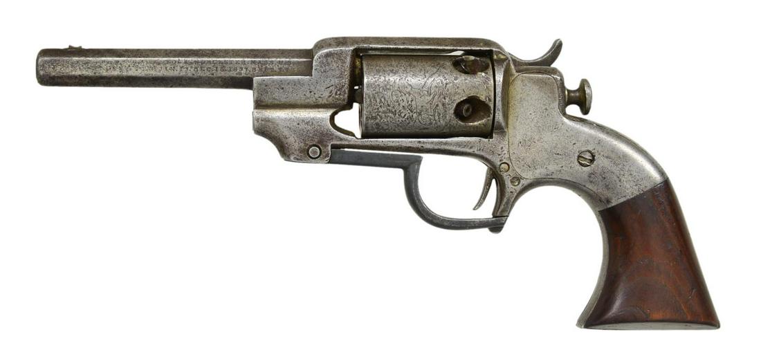 ALLEN & WHEELOCK SIDEHAMMER REVOLVER.: Cal. 28. S# 972. Bbl. 4" oct. w/ blade front sight. 5 Shot roll engraved cyl. Side hammer solid frame action. Standard model w/ catch located at rear of trigger guard that rotates forward to operate l