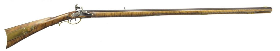 CONTEMPORARY FULL STOCK KENTUCKY FLINTLOCK RIFLE: BY G. P. MCCOY. Cal. 40. NSN. Bbl. 41 1/2" oct., fitted w/ full buckhorn rear & German silver blade front sights is hand engraved â€œG. P. MCCOY”. On top flat flintlock w/ rebated tail has s