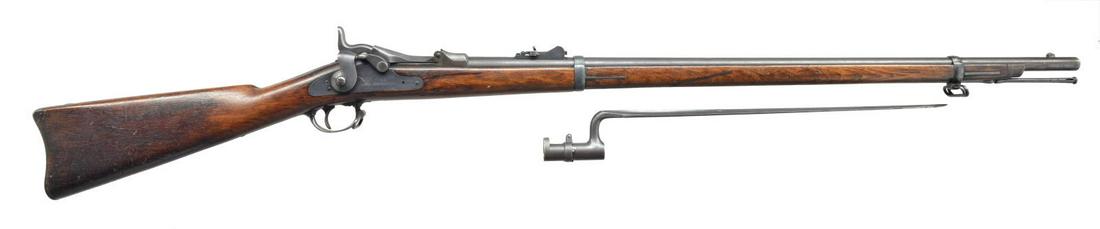 SPRINGFIELD 1873 TRAPDOOR RIFLE.: Cal. 45-70. S# 96539. Bbl. 32 5/8" w/ barleycorn front sight & Model 1873 rifle rear sight. 1873 Dated low arch breech block. 2 Band walnut stock w/ iron fittings & slotted tip ramrod. Left side of re