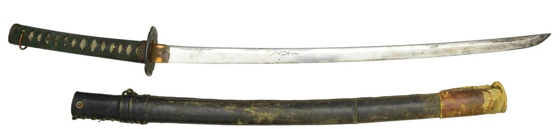 JAPANESE KATANA.: Overall length: 37 1/4". Blade length: 26". Blade has a wavy hamon & has a dragon cut into 1 side w/ what appears to be a comet. The other side has a few curved lines cut in. Brass habaki. Iron tsuba