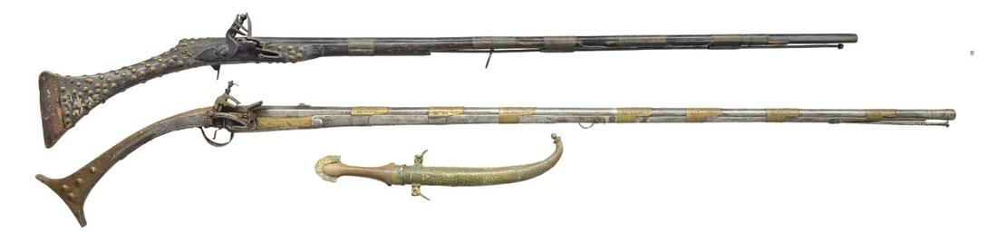 2 EARLY 19TH CENTURY EASTERN FLINTLOCK: MUSKETS & JAMBIYA. 1) ALL METAL BALKAN FISHTAIL MIQUELET. Cal. 60. NSN. Bbl. 46 1/2". 59" Overall. All metal, including stock. 7 Brass bbl. bands w/ Arabesque design. Well made miquelet lock has unkno