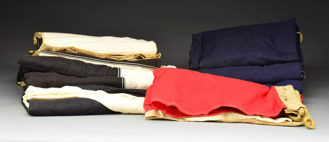 9 LARGE NAVAL SIGNAL FLAGS.: This group consists of 9 very lg. naval signal flags produced by the Valley Forge Flag Company of Spring City, PA. Each flag is numbered on the hoist & attaches w/ ropes & heavy brass hooks. CONDITION