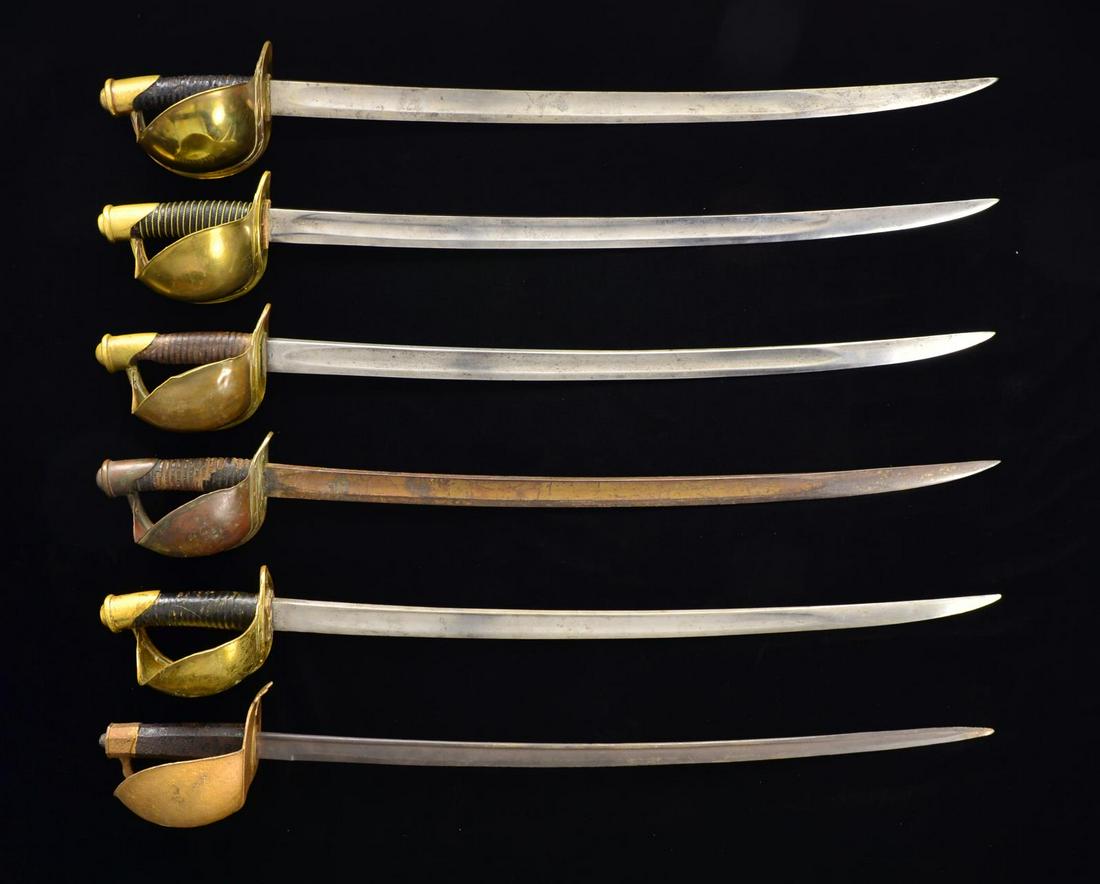 6 NAVAL CUTLASSES.: This group consists of 5 M1860 US Naval cutlasses all lacking scabbards & 1 M1833 French Naval cutlass w/ a replaced blade & no scabbard. 1) M1860. Overall length: 32". Blade length: 25 1/2". Ricasso