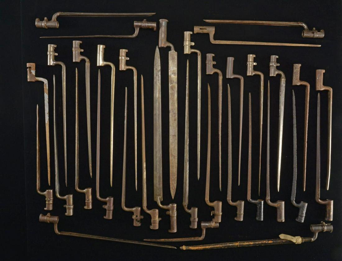 34 MOSTLY US & BRITISH TRIANGULAR SOCKET BAYONETS.: This lg. lot includes 4 US M1816 bayonets. / 2 US M1816 excavated bayonets. / 1 M1809 Prussian bayonet. / 5 Enfield pattern bayonets. / 2 Excavated Enfield pattern bayonets. / 3 British Martini Henry 