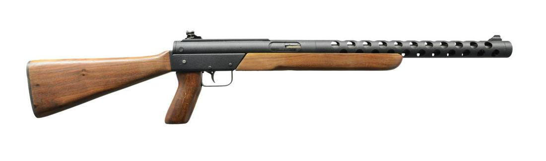 DMAX 450C SEMI AUTO RIFLE.: Cal. 45 ACP. S# 00578. Bbl. 16". An interesting closed bolt semi automatic carbine mfg. in Auburn, WA USA. A tubular receiver design w/ a full length ventilated bbl. shroud in a finish that heavily re