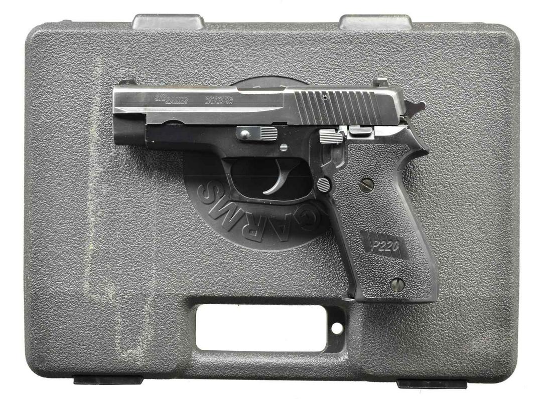 SIG ARMS P220 TDA 45 ACP PISTOL WITH DECOCKER.: Cal. 45 ACP. S# G295965. Bbl. 4.4". Traditional dbl. action semi-automatic pistol w/ left side decocker. Factory 3 dot night sights. Left side American style mag. release. Matte black finish on all ex