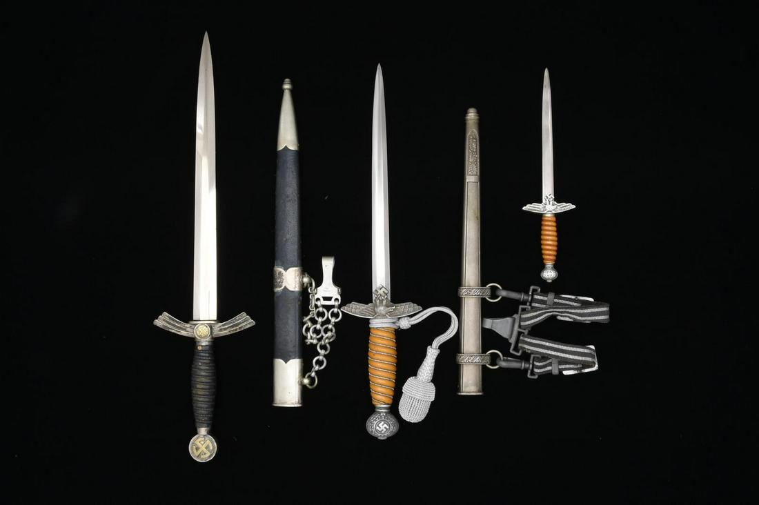 3 WWII GERMAN LUFTWAFFE DAGGERS.: 1) 1ST MODEL. Overall length: 19 1/8". Plain blade marked, â€œPAUL WEYERSBERG & CO SOLINGEN (logo)”. Silver plated guard & pommel w/ gilded mobile Party symbol. Wire wrapped, blue leather gr