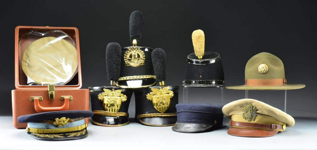 LARGE US MILITARY HAT & HELMET GROUP.: This lg. & varied group of hats includes 1 WWII era Navy officerâ€™s hat w/ black crown. Visor is split. / 1 WWII era field grade Army officerâ€™s hat w/ dark blue crown & gold bordered, lig