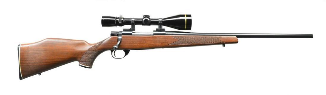 HOWA MODEL 1500 BOLT ACTION RIFLE.: Cal. 243 Win. S# B023228. Bbl. 22" sporter weight w/out sights. Leupold VARI-X III 3.5-10x50 gloss finished gold ring scope w/ heavy duplex reticle on Leupold QD mts. 2 Lug action w/ right side safety