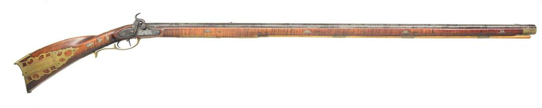 RARE EARLY PERCUSSION SNYDER COUNTY PA RIFLE BY: JOSEPH SHAFER (SCHAEFER). Cal. 55 smooth. NSN. Bbl. 43 3/4" full oct., 59" overall. Curly maple stock w/ 4 piece brass engraved patchbox. 20 Silver inlays. Gun is incised carved behind the cheekpiece.