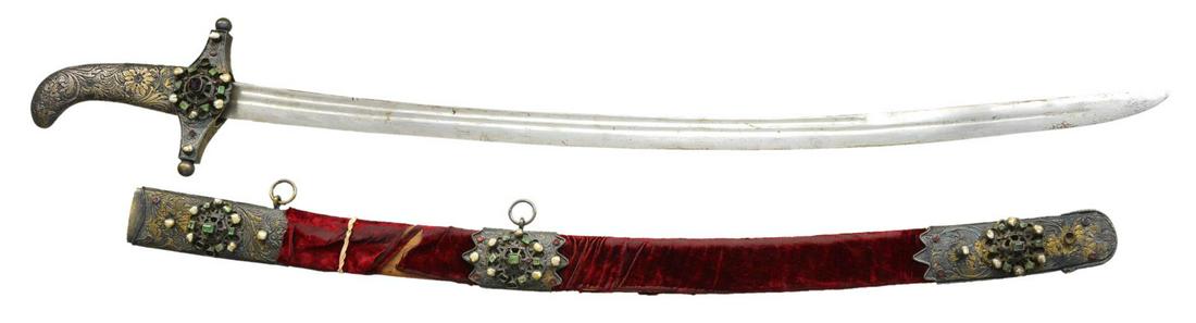 EASTERN EUROPEAN OR NEAR EASTERN SWORD: WITH HEAVY OTTOMAN INFLUENCE. This attractive weapon could be Turkish or could have been made in the area around Hungary or Poland. It shows heavy Ottoman influence & somewhat resembles a shamshir. It