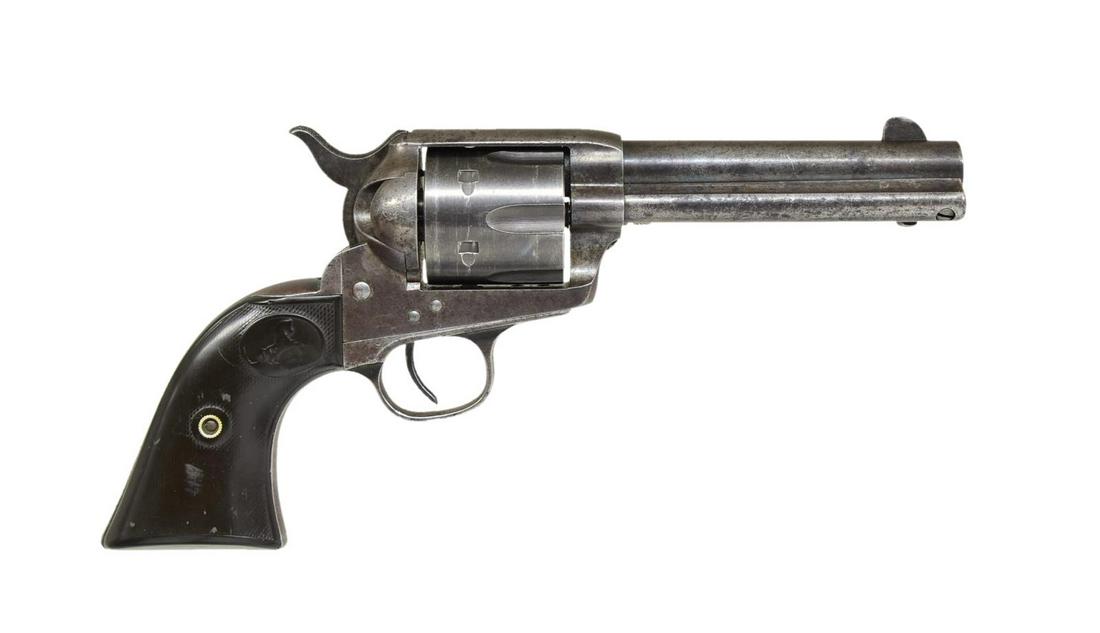 COLT SAA REVOLVER.: Cal. 45 Colt. S# 161430. Bbl. 4 3/4" w/ blade front sight. 6 Shot fluted cyl. appears to be later replacement. Black powder frame w/ 2 line patent date markings on left side. 2 Piece checkered hard ru