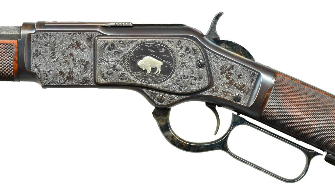 WINCHESTER 1873 CUSTOM ENGRAVED LEVER ACTION: RIFLE. Cal. 32 WCF (32-20). S# 381474B. Bbl. 26" oct., 2" longer than standard. German silver blade Rocky Mountain front sight & elevator adj. sporting rear sight. Full length mag. Action has unsigned