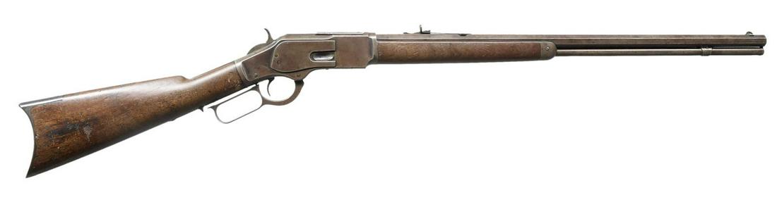 WINCHESTER 1873 THIRD MODEL LEVER ACTION RIFLE.: Cal. 32 WCF (32-20). S# 212027B. Bbl. 24" oct. w/ German silver blade front sight & original sporting rear sight. Full length tubular mag. Walnut forearm & straight grip stock w/ crescent steel buttpl