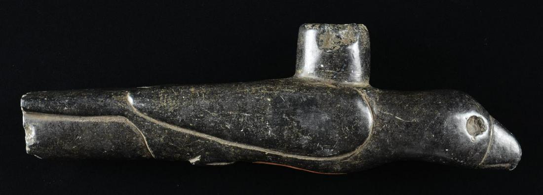 NATIVE AMERICAN BIRD EFFIGY PIPE.: A fine example of a steatite bird effigy pipe measuring 10 1/2" in length & approx. 3 1/4" in height. Bird appears to be an eagle w/ wings tucked in & feet tucked under simulating a dive towards prey.