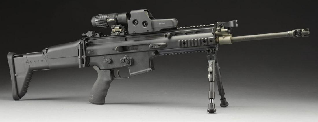 LIKE NEW FNH SCAR 16S RIFLE WITH ACCESSORIES.: Cal. 5.56mm. S# LC13523. Bbl. 16". The wildly popular SCAR 16 self loading rifle; as awe inspiring in hand as it is on the silver screen & the glossy magazine pages, this one can be yours! All exposed