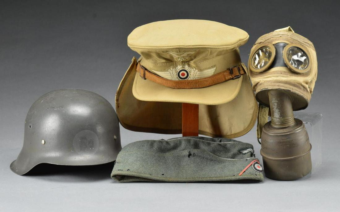 2 WWII GERMAN HATS, 1 HELMET & 1 GAS MASK.: 1) LUFTWAFFE TROPICAL. This early Luftwaffe Afrika Korps soft visor cap is commonly referred to as a â€œHermann Meyer” cap. It is khaki in color w/ a slightly lighter khaki neck cover. The n