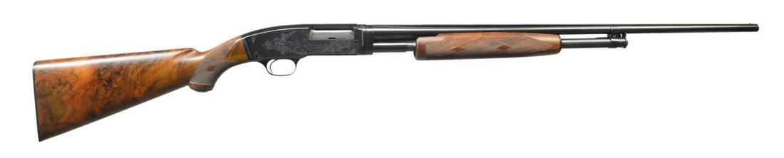 NICK KUSMIT ENGRAVED WINCHESTER MODEL 42 PUMP: SHOTGUN. Cal. 410 3". S# 69484. Bbl. 26" w/ solid rib, fixed Full choke & steel bead. Action has custom No. 3 engraving by renowned former factory engraver Nick Kusmit. Right side vignette features a