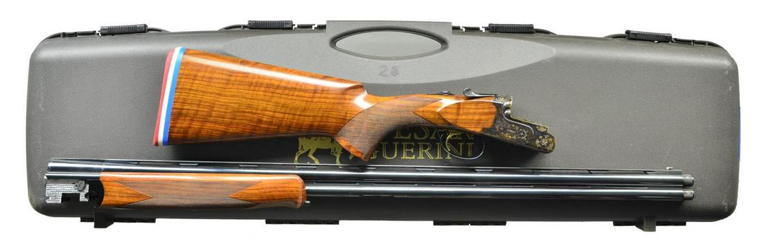 CAESAR GUIRINI "SUMMIT" SPORTING O/U W/ CASE &: & ACCESSORIES. Cal. 28 Ga. 2 3/4". S# 106257. The 32" monobloc bbls. w/ matted ventilated top rib & ventilated side ribs are fitted w/ interchangeable choke tubes. All factory markings & warning are o
