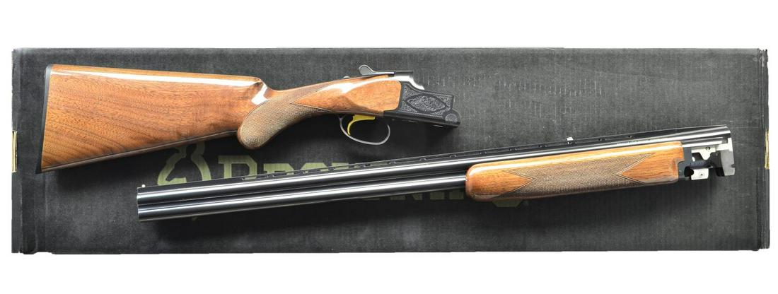BROWNING CITORI LIGHTNING GRADE 1 O/U SHOTGUN.: Cal. 28 Ga,. 2 3/4". S# 31834ZT131. Bbls. 28" vent rib w/ Invector chokes & steel bead. IC, MOD & FULL choke tubes included. Blue finish boxlock action w/ scroll ornamentation. Gold finished SST. Sele